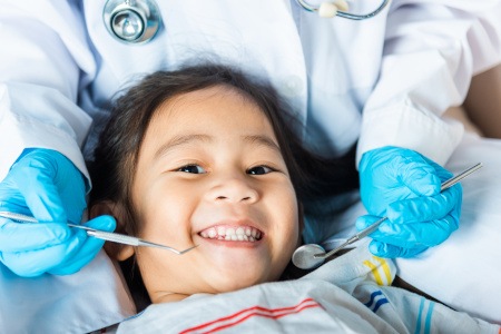 Child smiling during dental checkup